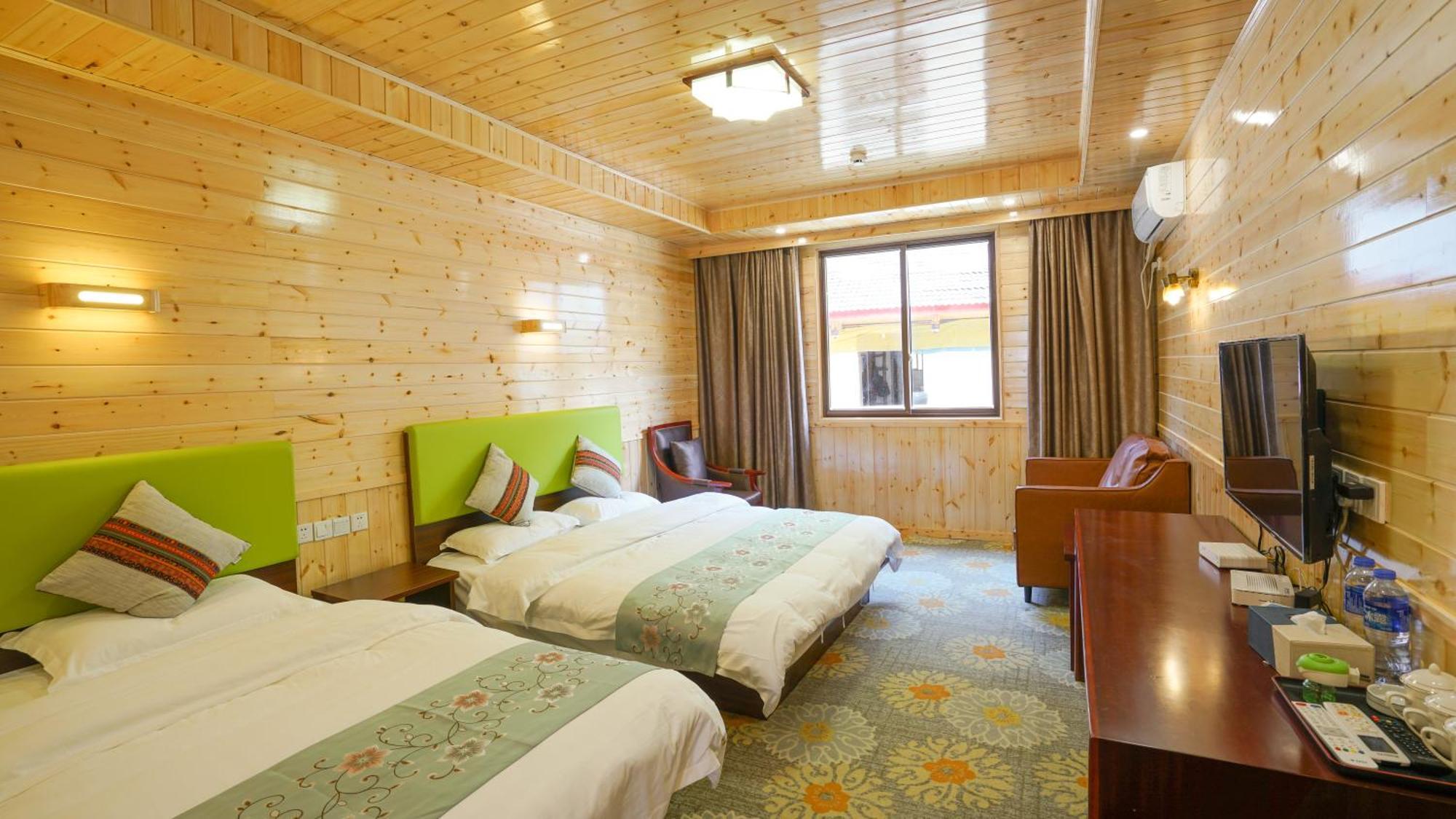 Jiuzhaigou Leisure Inn Quarto foto